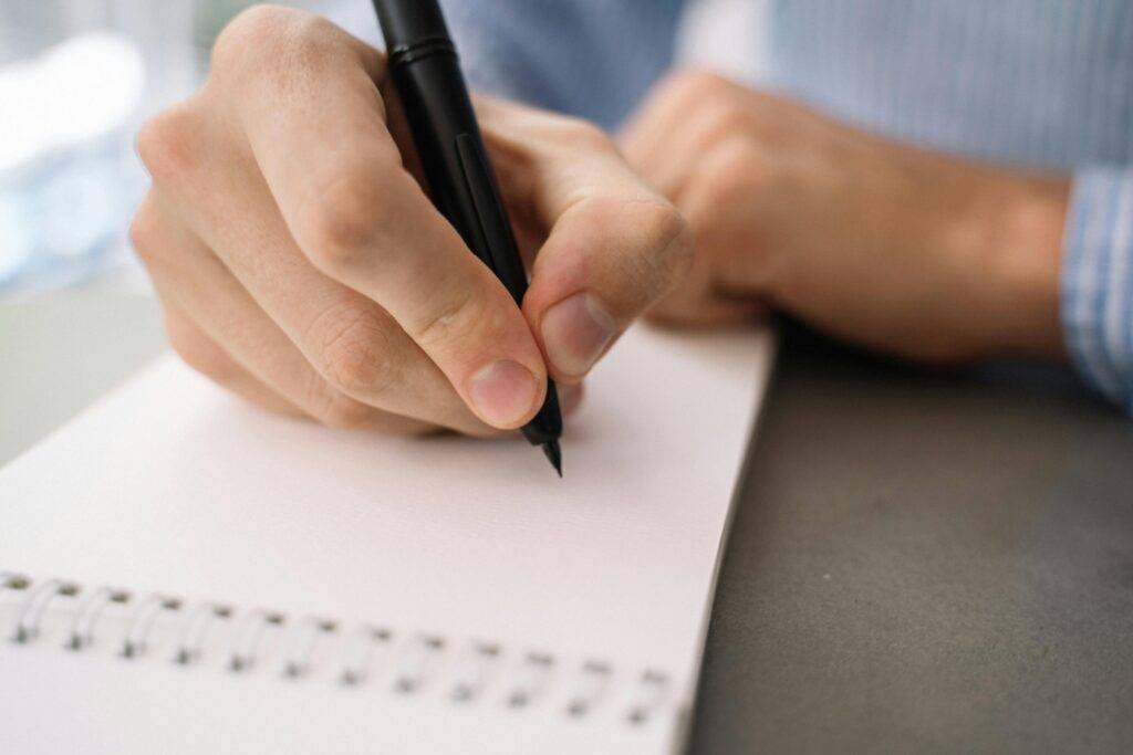 A business owner checking off a delivery list as supplies are brought in. The image conveys consistency, planning, and stress-free operations.