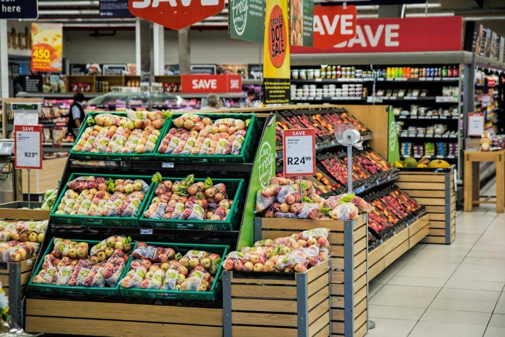A calm, well-stocked grocery store aisle in the early morning with no crowds. The image suggests a peaceful shopping experience with ideal timing.